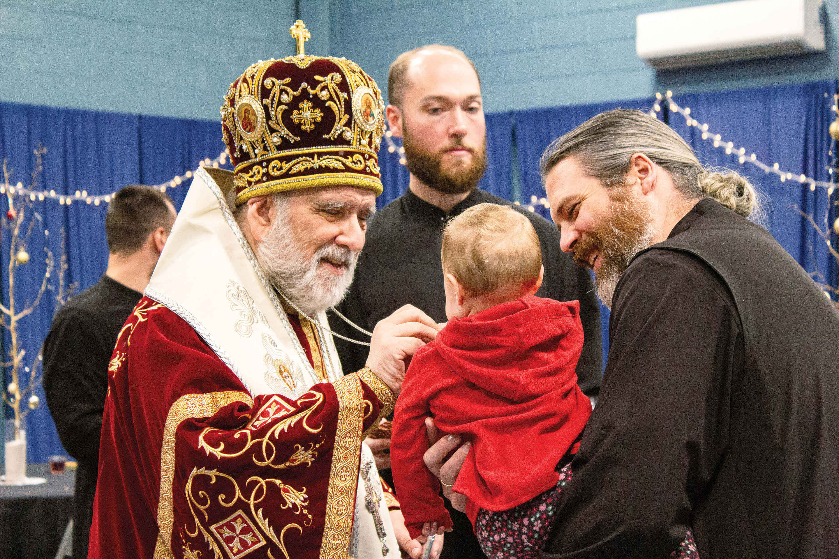 St. Tikhon's Seminary Community seminarians and a child being blessed by the rector.